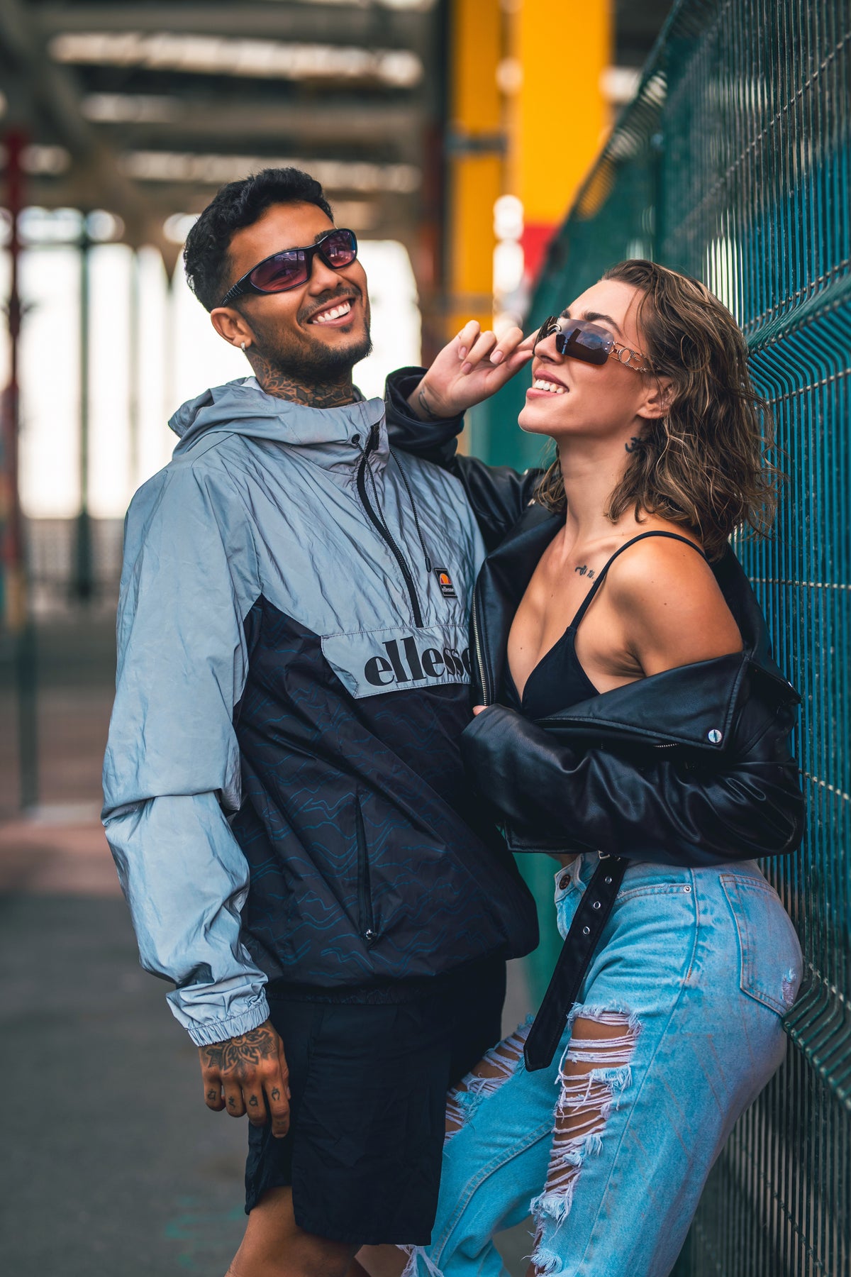 Two people wearing EYENEED eyewear outdoors