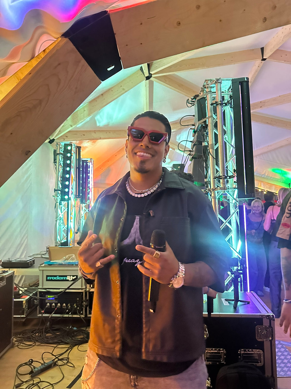 Person wearing EYENEED eyewear at an event
